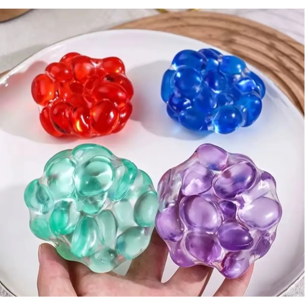 Pelota Squishy Antiestrés Con Piedras Sonoras Sensorial